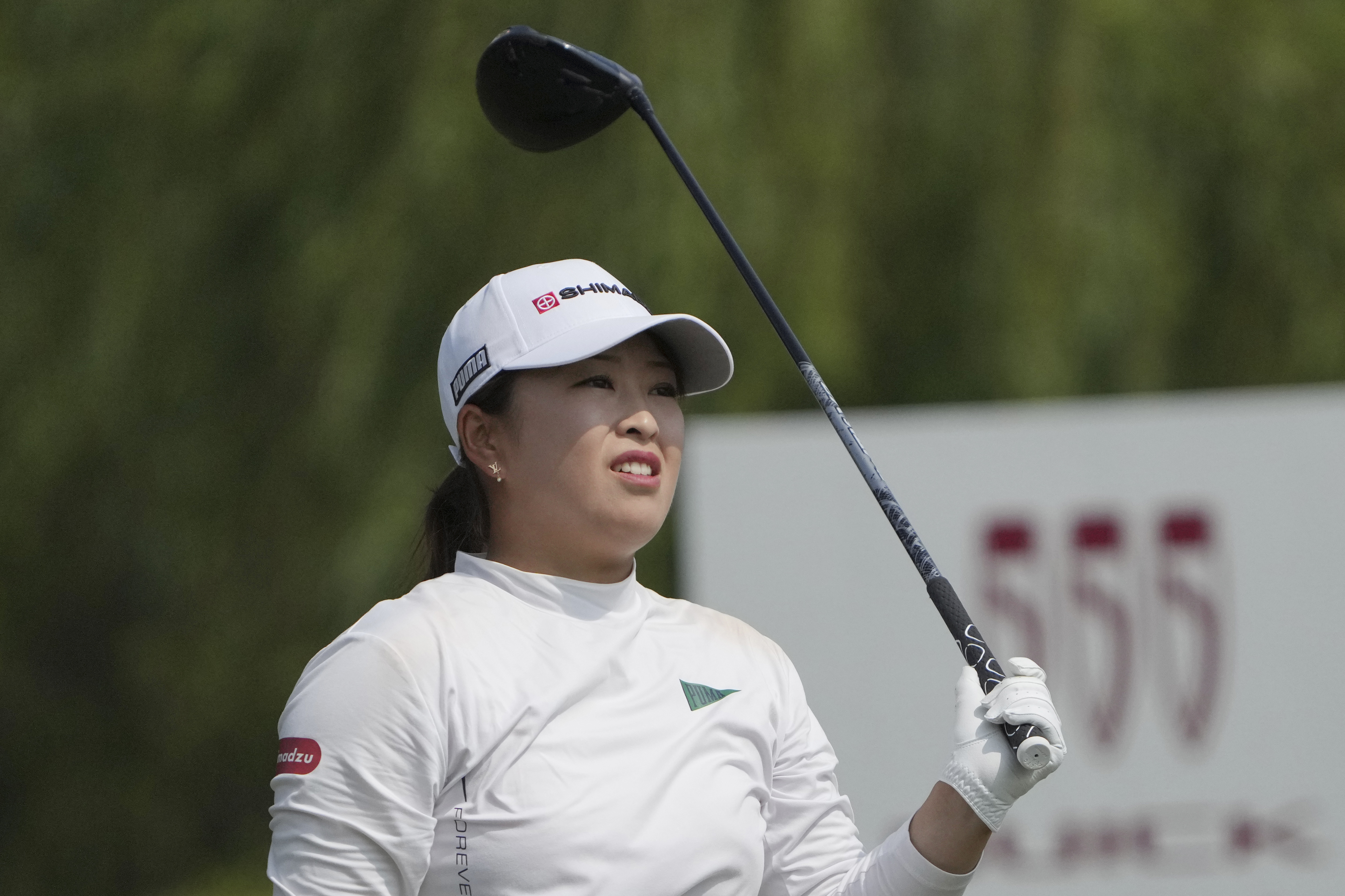 Mao Saigo of Japan watches her tee shot on the 4rd hole during the third round of the LPGA Shanghai at Shanghai Qizhong Garden Golf Club in Shanghai, China, Saturday, Oct. 12, 2024.