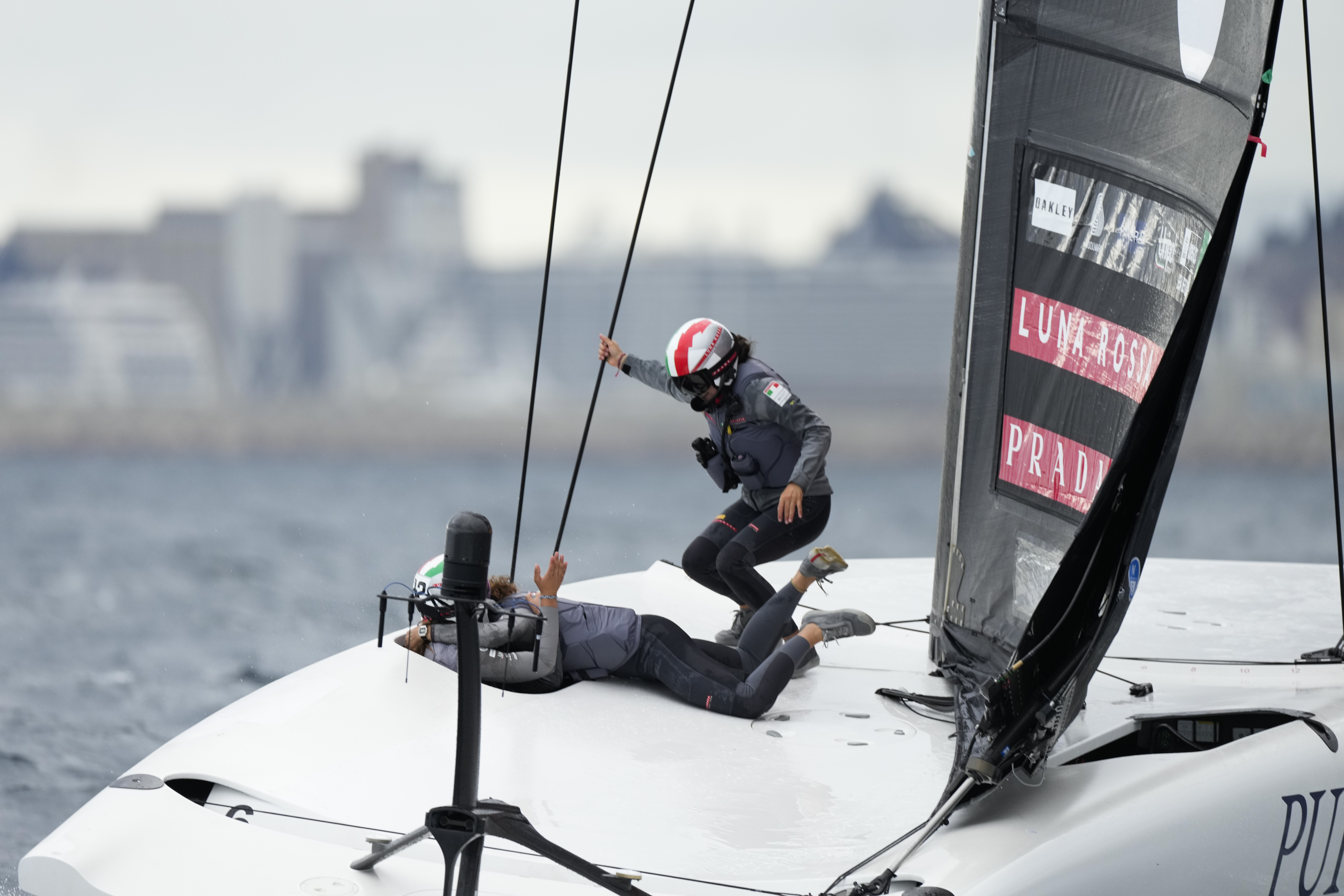 Luna Rossa Prada Pirelli's team celebrates after winning the Puig Women's America's Cup race in Barcelona, Spain, Saturday, Oct. 12, 2024.
