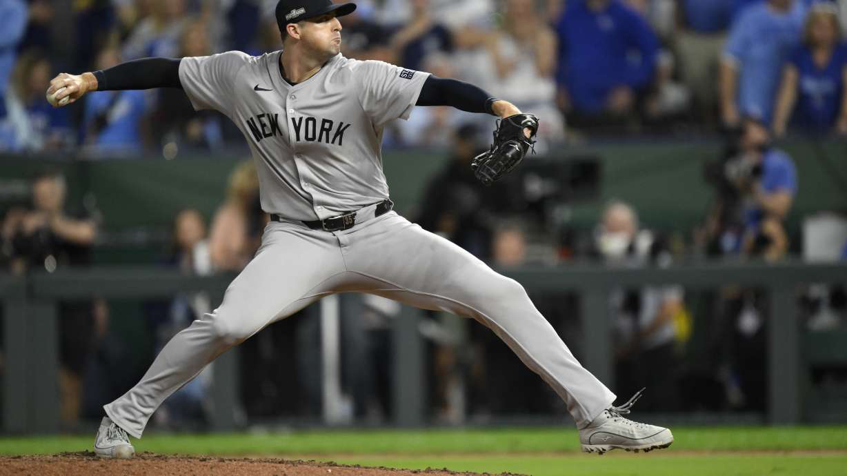 New York Yankees relief pitcher Clay Holmes throws during the eighth inning in Game 4 of an American League Division baseball playoff series against the Kansas City Royals Thursday, Oct. 10, 2024, in Kansas City, Mo.