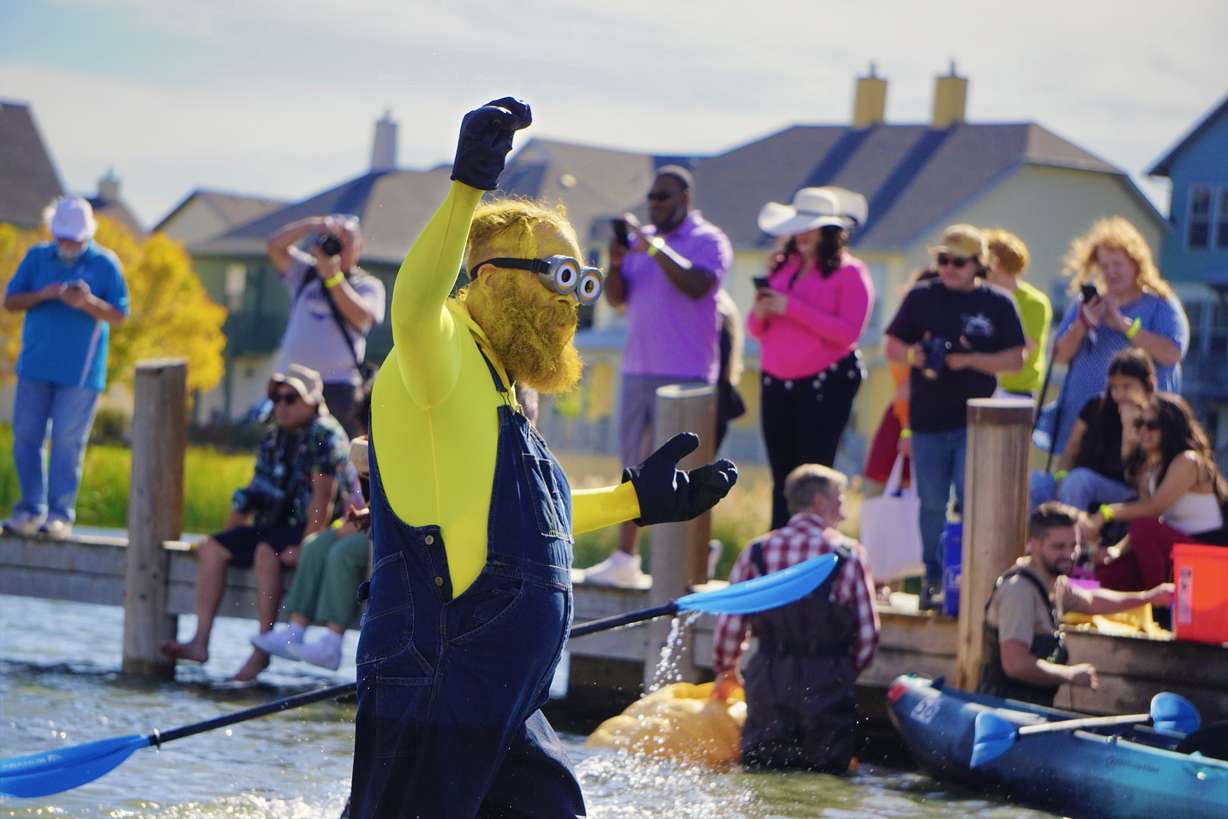 Clint Nash, dressed as a Minion, competed in the 13th annual Ginormous Pumpkin Regatta at Oquirrh Lake in Daybreak Saturday, Oct. 12, 2024.