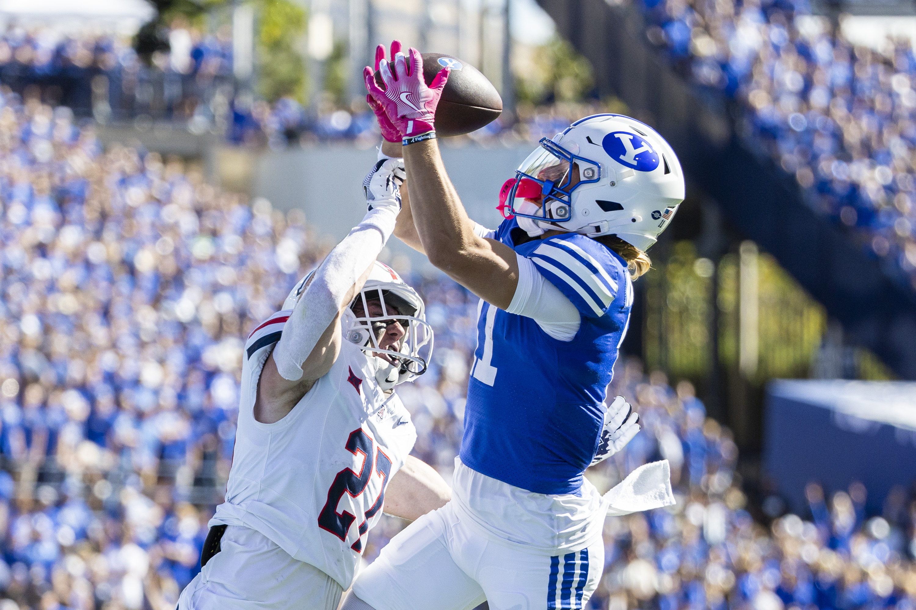 BYU wide receiver Parker Kingston (11) makes a touchdown reception while guarded by Arizona Wildcats defensive back Owen Goss (27) during a game held at LaVell Edwards Stadium in Provo on Saturday, Oct. 12, 2024.