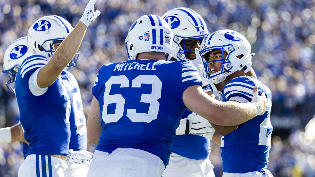 BYU running back LJ Martin (27) celebrates his touchdown reception with his teammates during a game against the Arizona Wildcats held at LaVell Edwards Stadium in Provo on Saturday, Oct. 12, 2024.