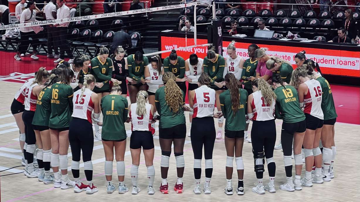 Utah and Baylor come together in prayer after the game, showcasing sportsmanship and respect from both teams.