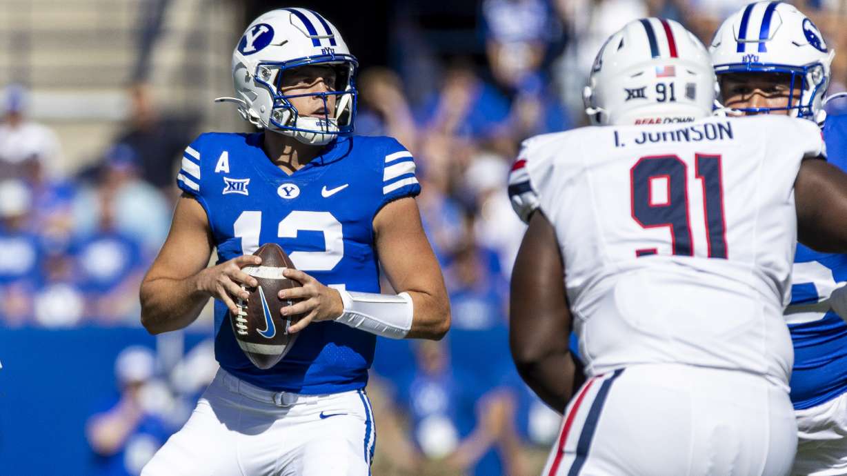 BYU quarterback Jake Retzlaff (12) looks to pass against the Arizona Wildcats during a game held at LaVell Edwards Stadium in Provo on Saturday, Oct. 12, 2024.