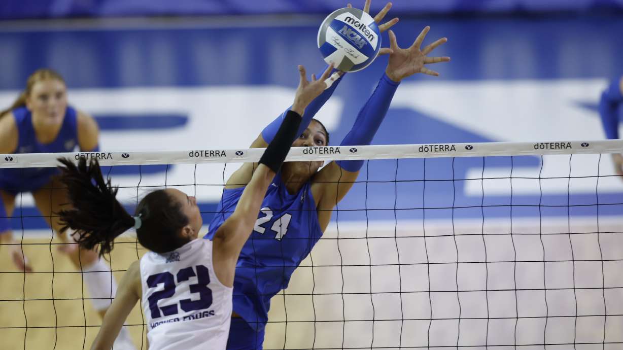 TCU's Melanie Parra tries to tool a shot around BYU's Brielle Kemavor during a Big 12 women's volleyball match, Saturday, Oct. 12, 2024 in Provo, Utah.