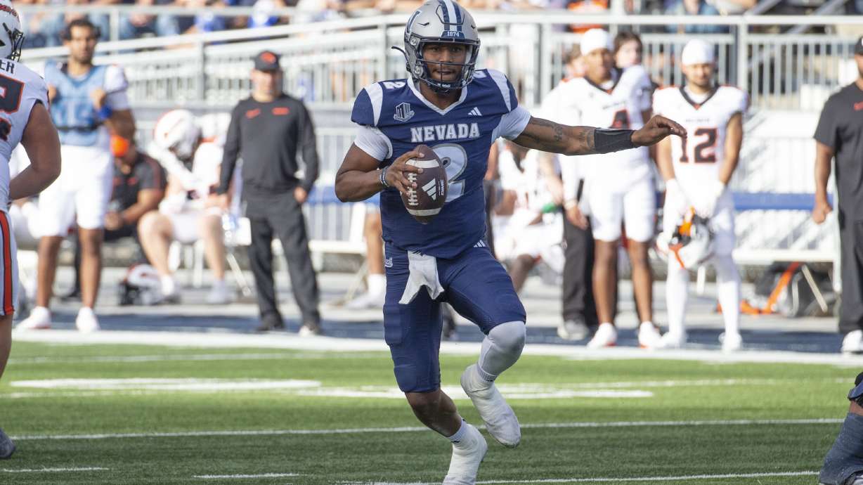 Nevada quarterback Brendon Lewis (2) rolls out against Oregon State in the first half of an NCAA college football game in Reno, Nev., Saturday, Oct. 12, 2024.