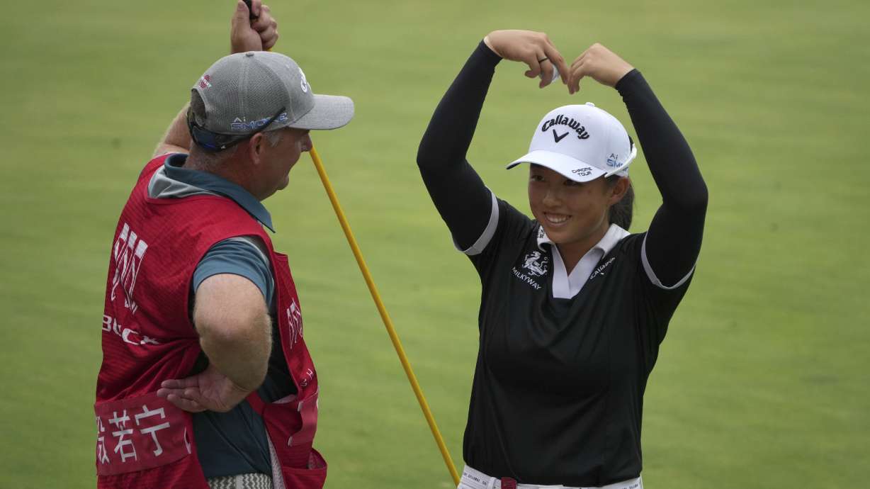 Ruoning Yin of China celebrates after winning in the final round of the LPGA Shanghai golf tournament at China's Shanghai Qizhong Garden Golf Club, Sunday, Oct. 13, 2024.
