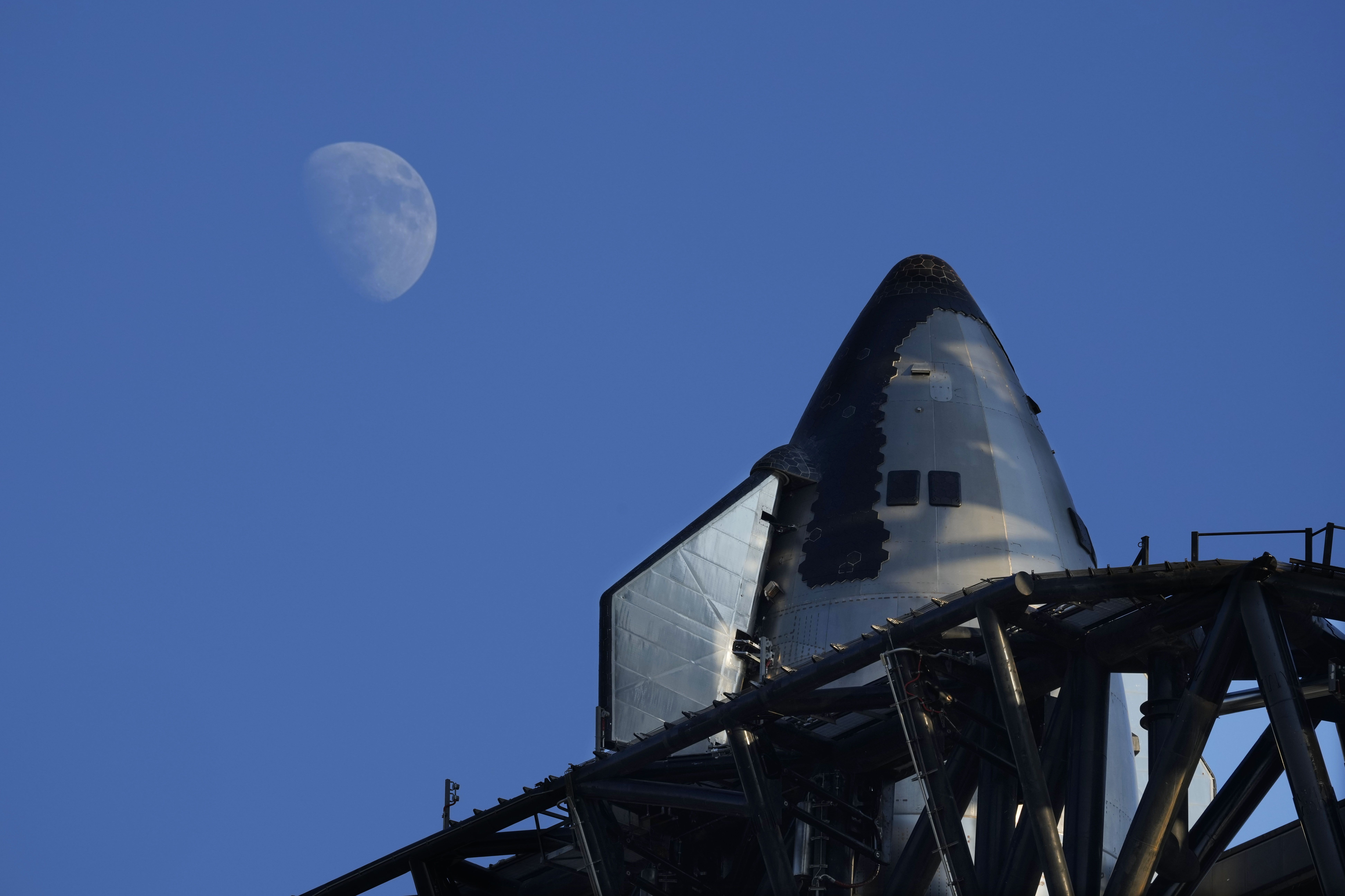 The moon rises over SpaceX's mega rocket Starship as it is prepares for a test launch Saturday, in Boca Chica, Texas.