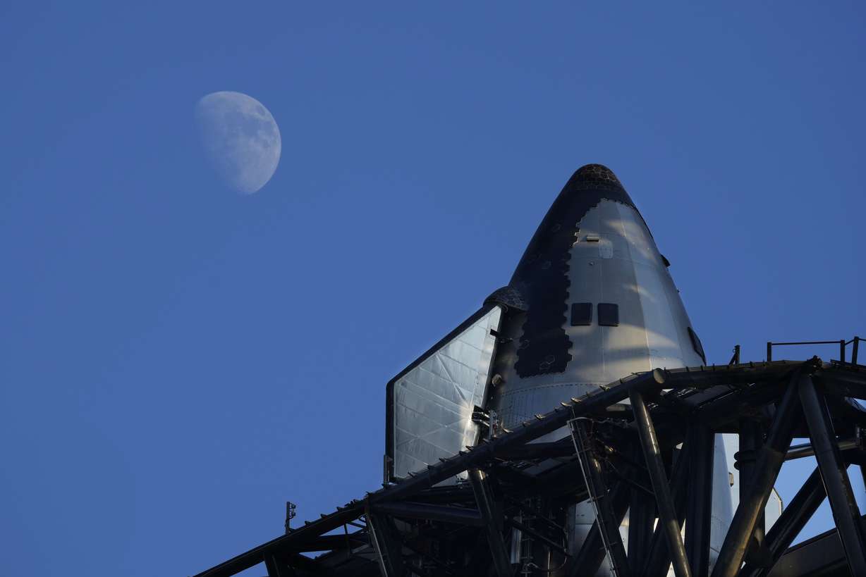 The moon rises over SpaceX's mega rocket Starship as it is prepares for a test launch Saturday, in Boca Chica, Texas.