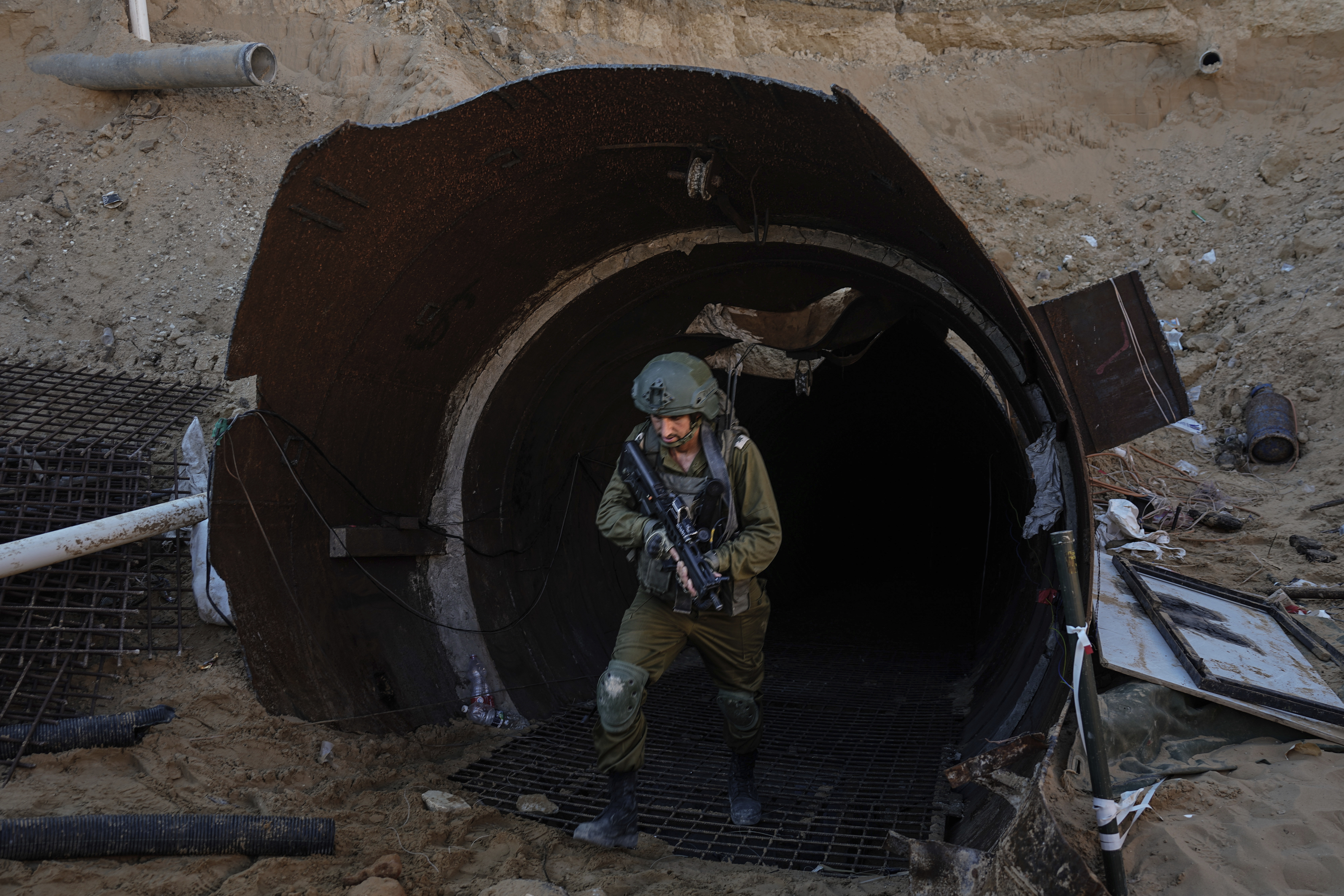Israeli soldiers exit a tunnel that the military says Hamas militants used to attack the Erez crossing in the northern Gaza Strip, Dec. 15, 2023.