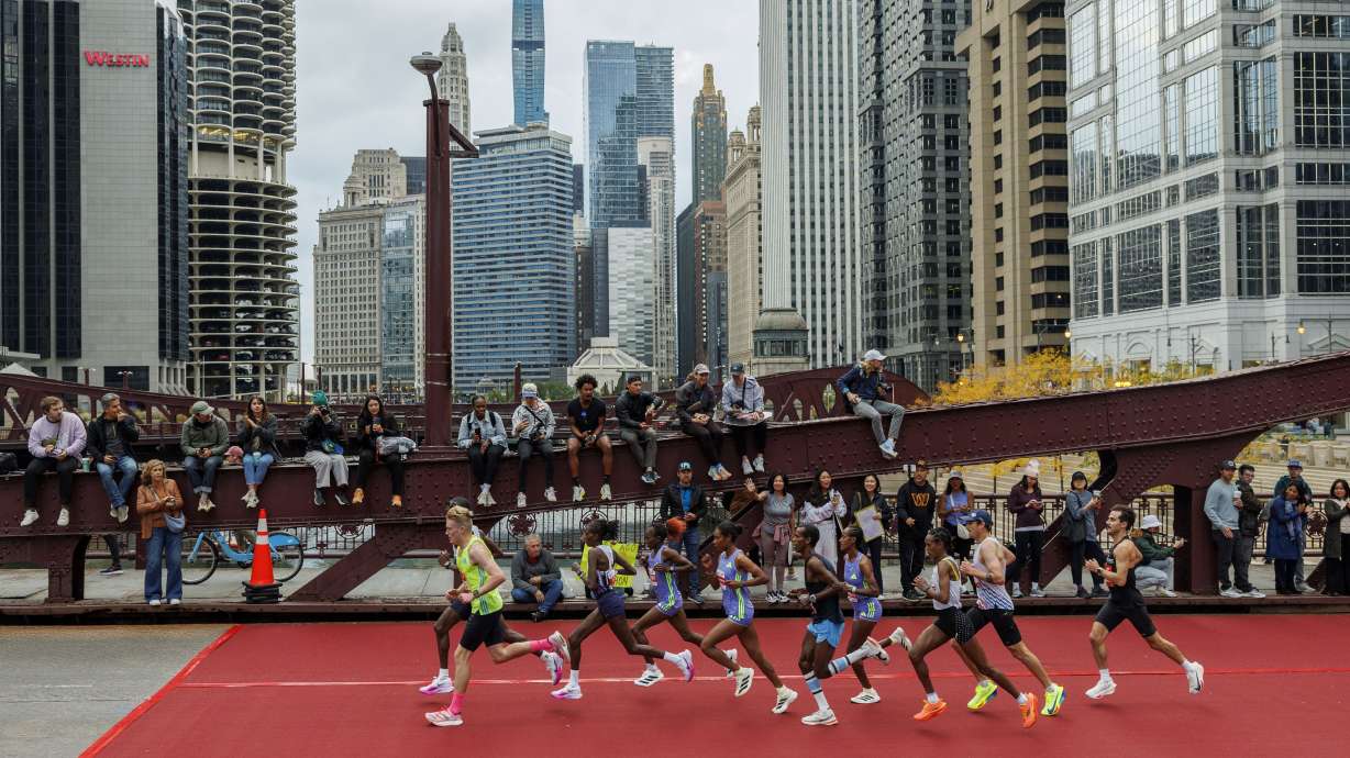 Runners cross the LaSalle Street bridge during the Chicago Marathon Sunday Oct. 13, 2024, in Chicago.