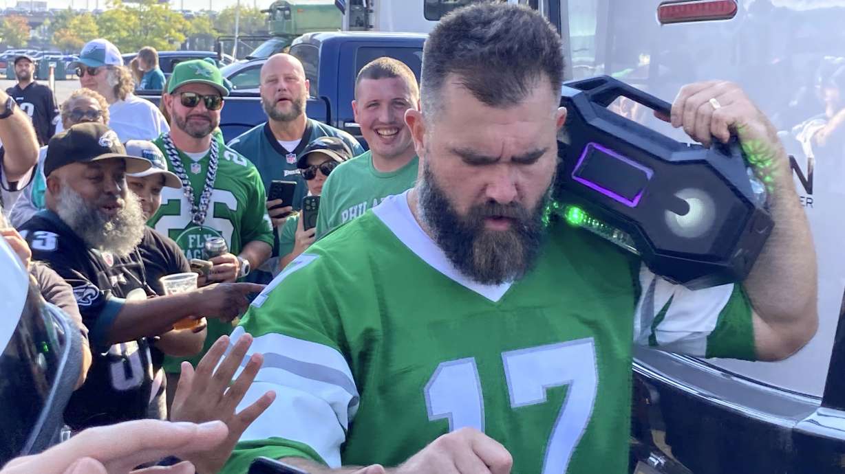 Retired Philadelphia Eagles center Jason Kelce greets fans at an impromptu appearance at a pregame tailgate party of an NFL football game between the Philadelphia Eagles and the Cleveland Browns, Sunday, Oct. 13, 2024 in Philadelphia.