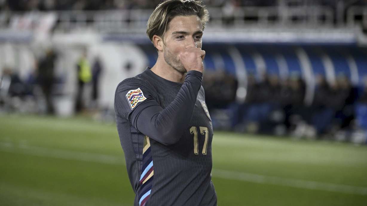 Jack Grealish of England celebrates after scoring the opening goal during the UEFA Nations League soccer match between Finland and England, at the Olympic Stadium in Helsinki, Finland, Sunday, Oct. 13, 2024.