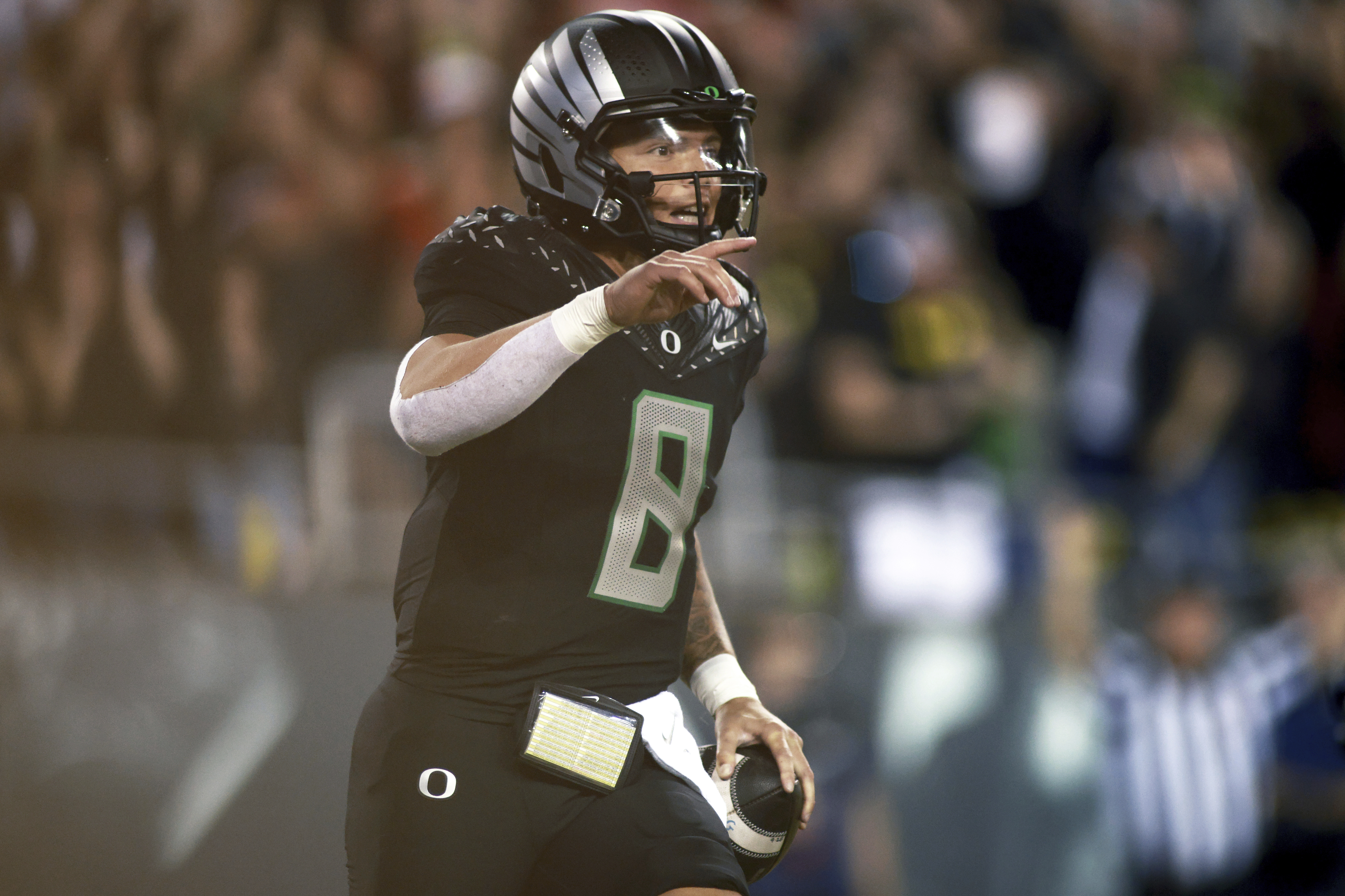 Oregon quarterback Dillon Gabriel (8) celebrates his touchdown during an NCAA college football game against Ohio State, Saturday, Oct. 12, 2024, in Eugene, Ore.