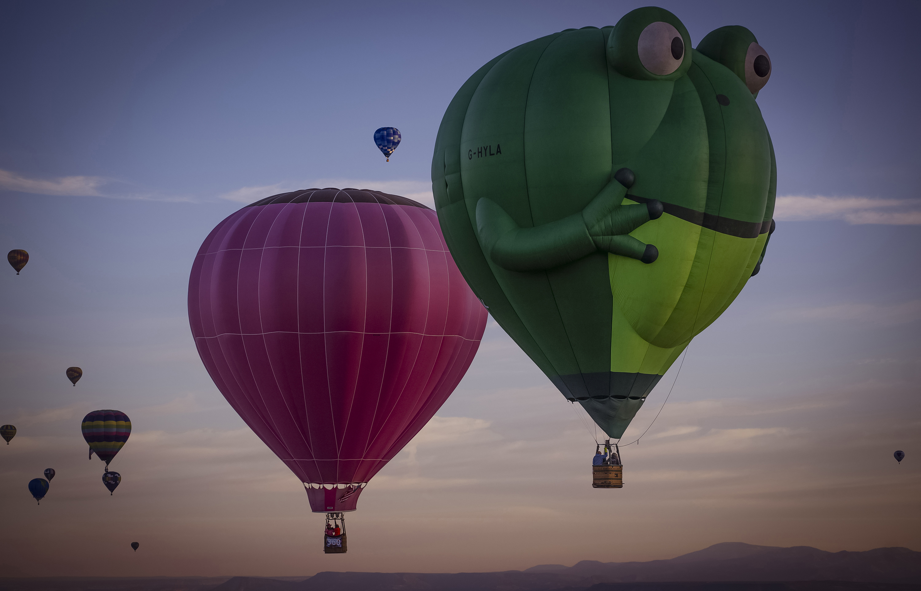 Balloons sail in the sky captured during flight in Meow Wolf's Skyworm hot air balloon during the Albuquerque International Balloon Fiesta at Balloon Fiesta Park in Albuquerque, N.M., on Tuesday.