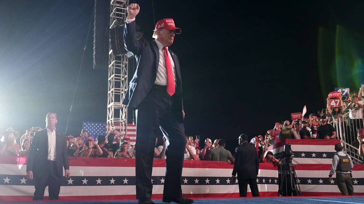 Republican presidential nominee former President Donald Trump gestures to the audience as he departs a campaign rally at the Calhoun Ranch, Saturday, in Coachella, Calif.