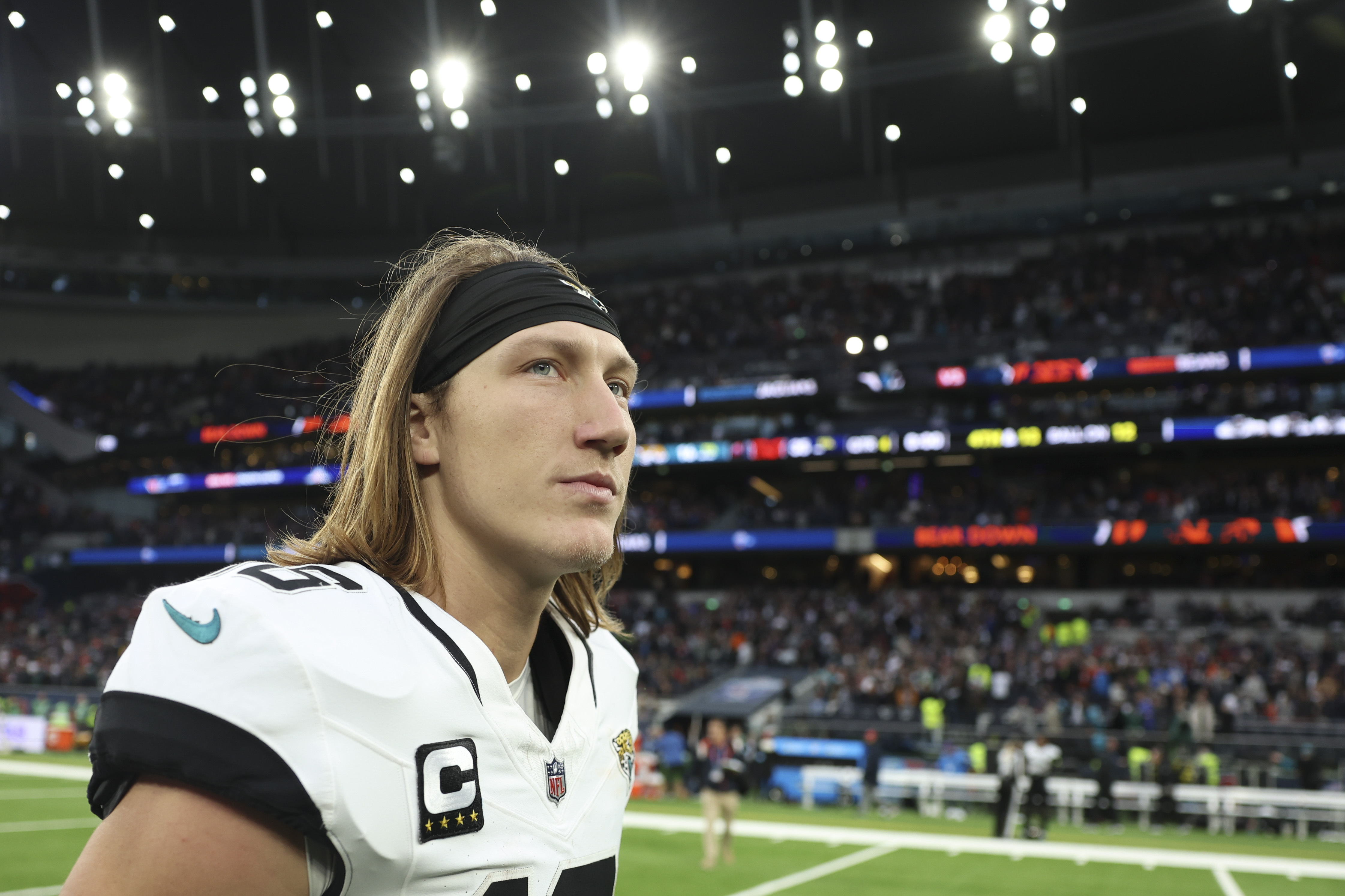Jacksonville Jaguars quarterback Trevor Lawrence (16) leaves the field after an NFL football game at the Tottenham Hotspur stadium between the Jacksonville Jaguars and Chicago Bears in London, Sunday, Oct. 13, 2024.