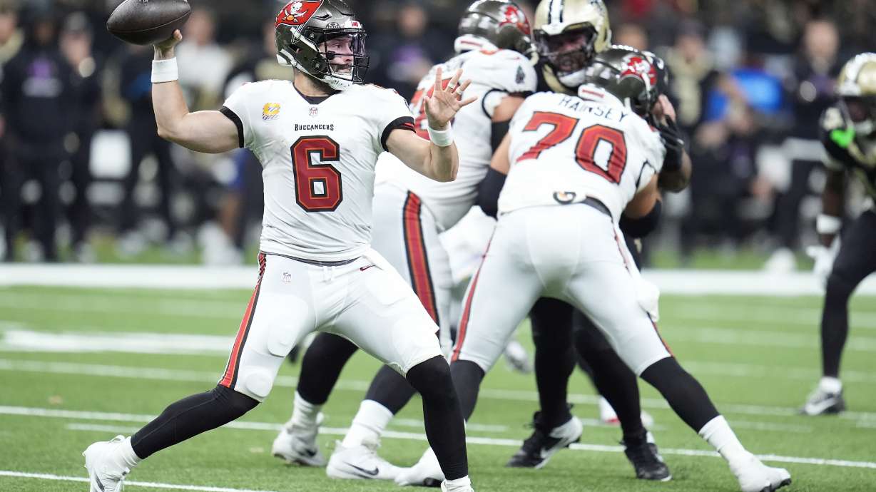 Tampa Bay Buccaneers quarterback Baker Mayfield (6) passes against the New Orleans Saints during the first half of an NFL football game in New Orleans, Sunday, Oct. 13, 2024.