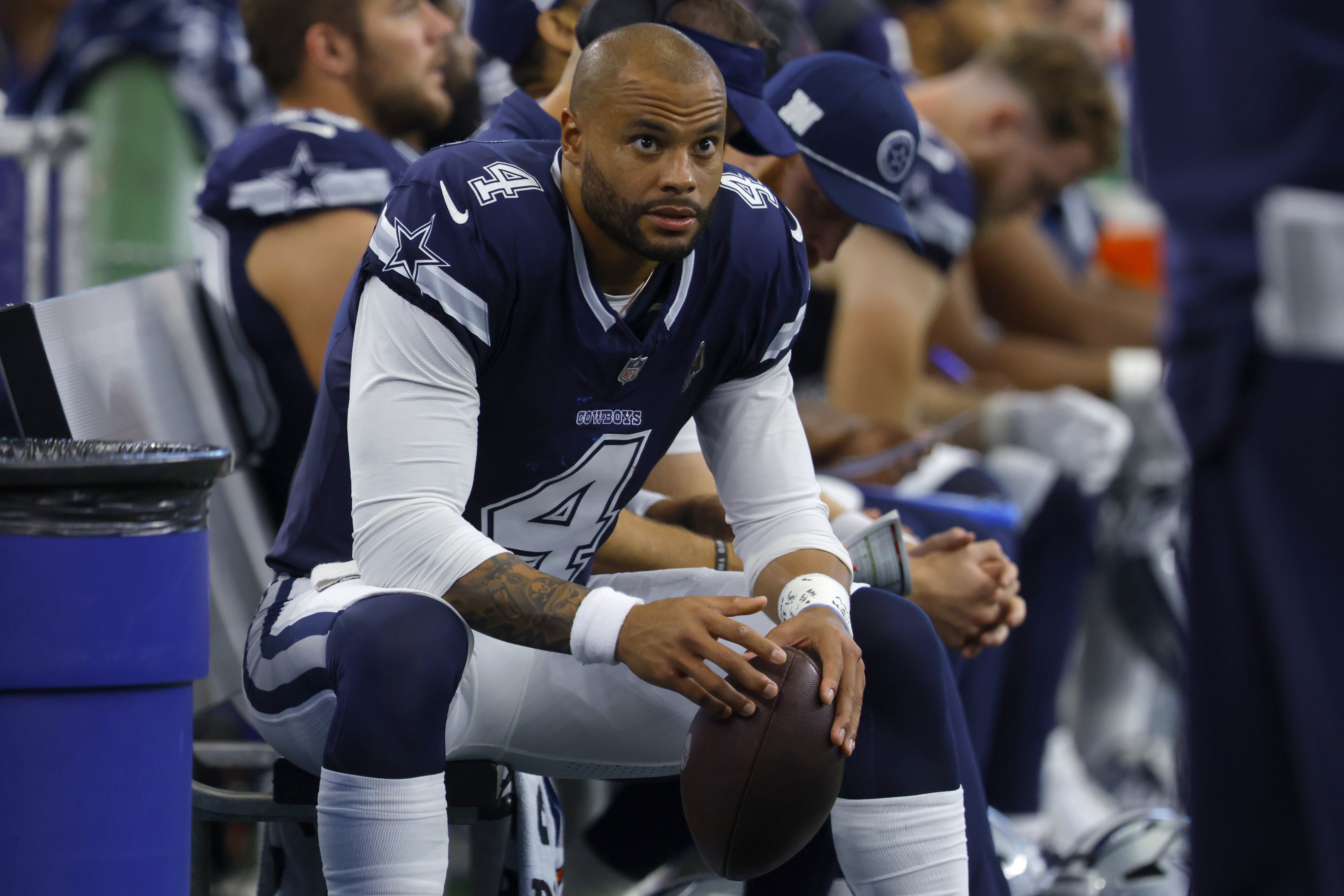 Dallas Cowboys quarterback Dak Prescott (4) sits on the bench in the first half of an NFL football game against the Detroit Lions in Arlington, Texas, Sunday, Oct. 13, 2024.