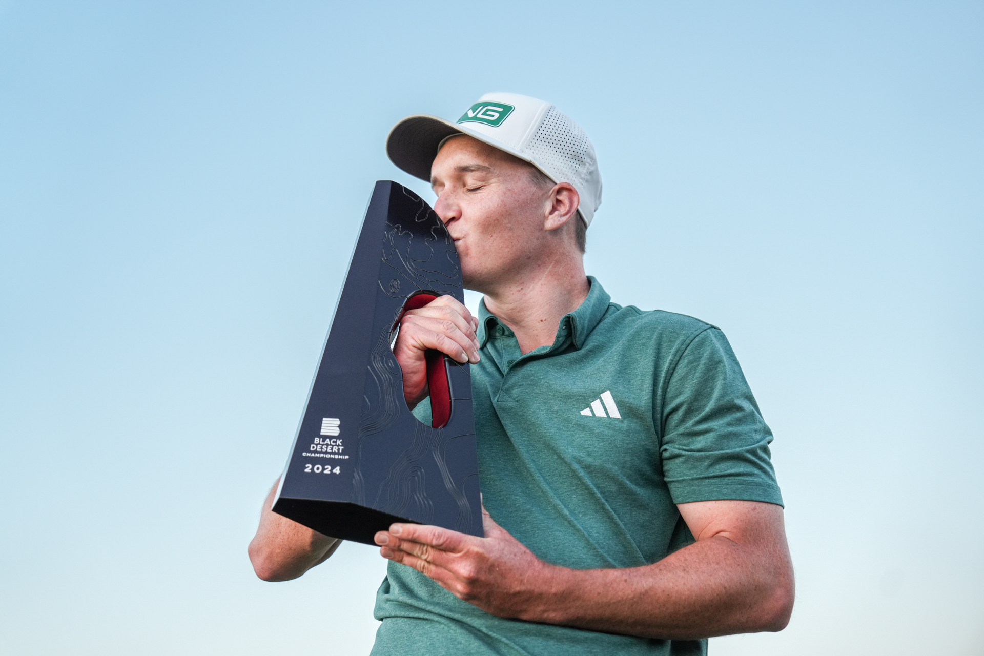 Matt McCarty poses with the trophy of the Black Desert Championship after winning his first PGA Tour event, Sunday, Oct. 13, 2024 in Ivins, Utah.