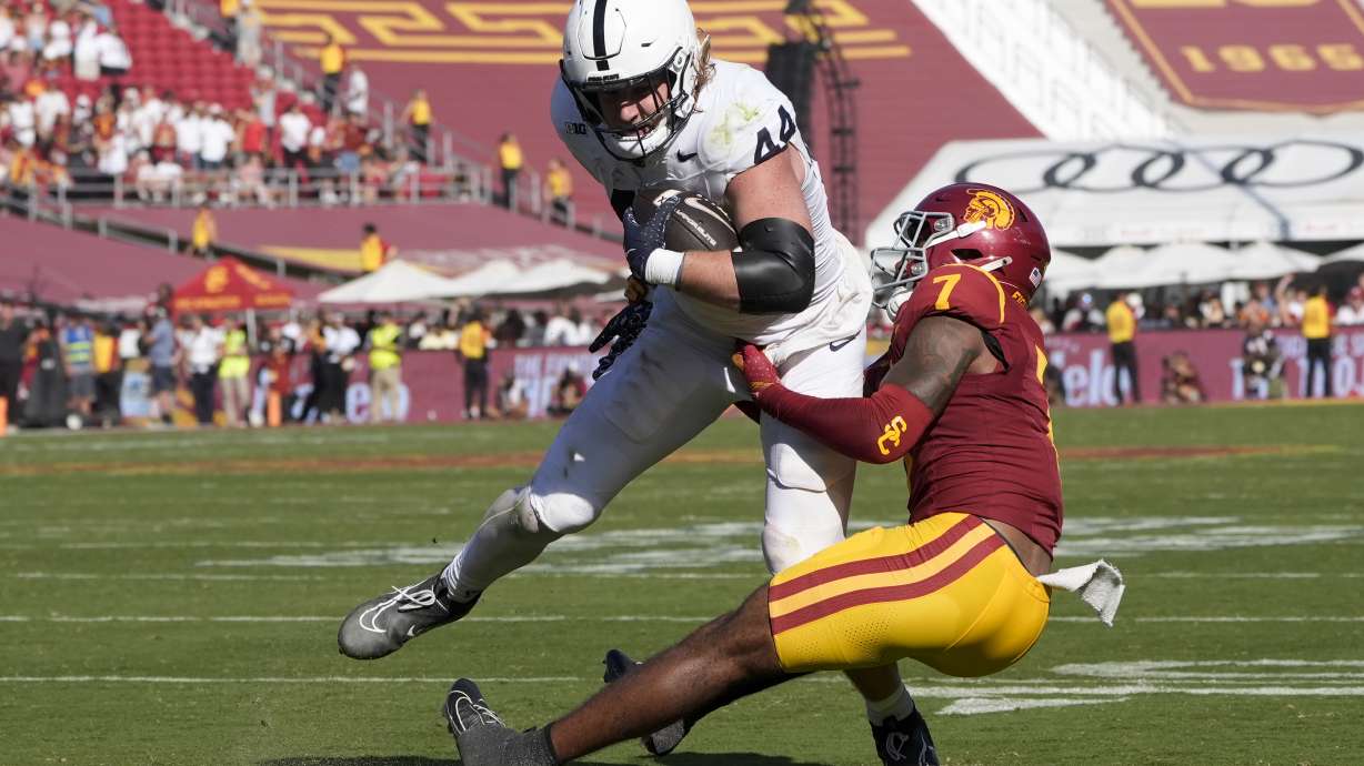 Penn State tight end Tyler Warren (44) makes a catch while being tackled by Southern California safety Kamari Ramsey (7) during second half of an NCAA college football game Saturday, Oct. 12, 2024, in Los Angeles.