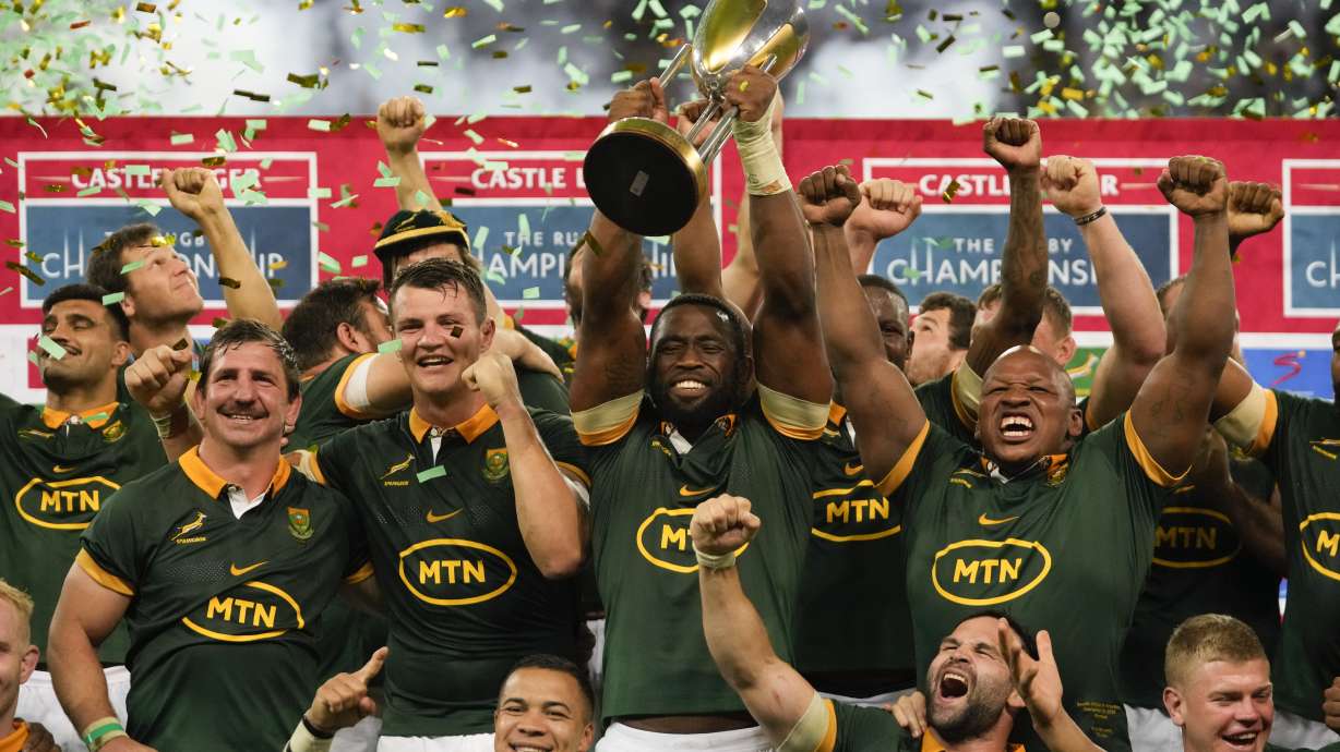 South Africa players celebrate with the trophy after defeating Argentina and winning the rugby championship at Mbombela stadium in Nelspruit, South Africa, Saturday, Sept. 28, 2024.