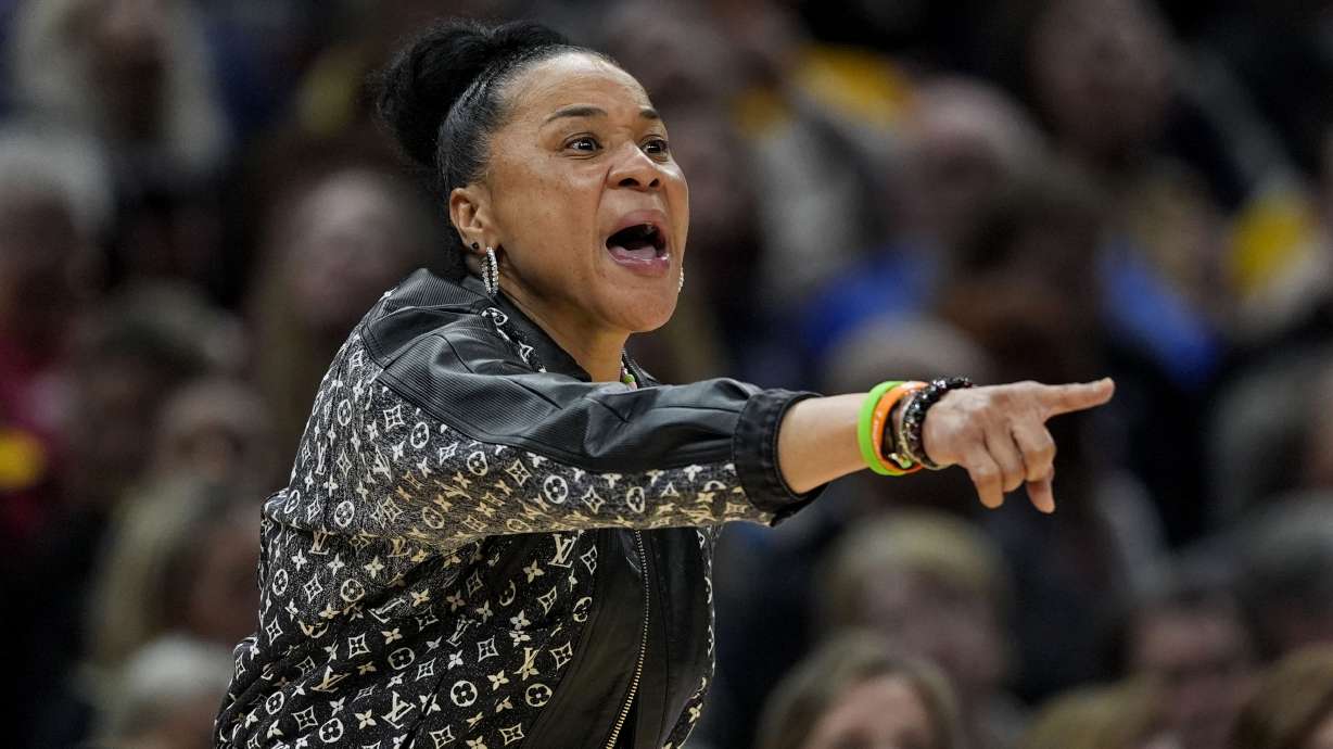 FILE- South Carolina head coach Dawn Staley directs her team during the second half of a Final Four college basketball game against North Carolina State in the women's NCAA Tournament, Friday, April 5, 2024, in Cleveland.