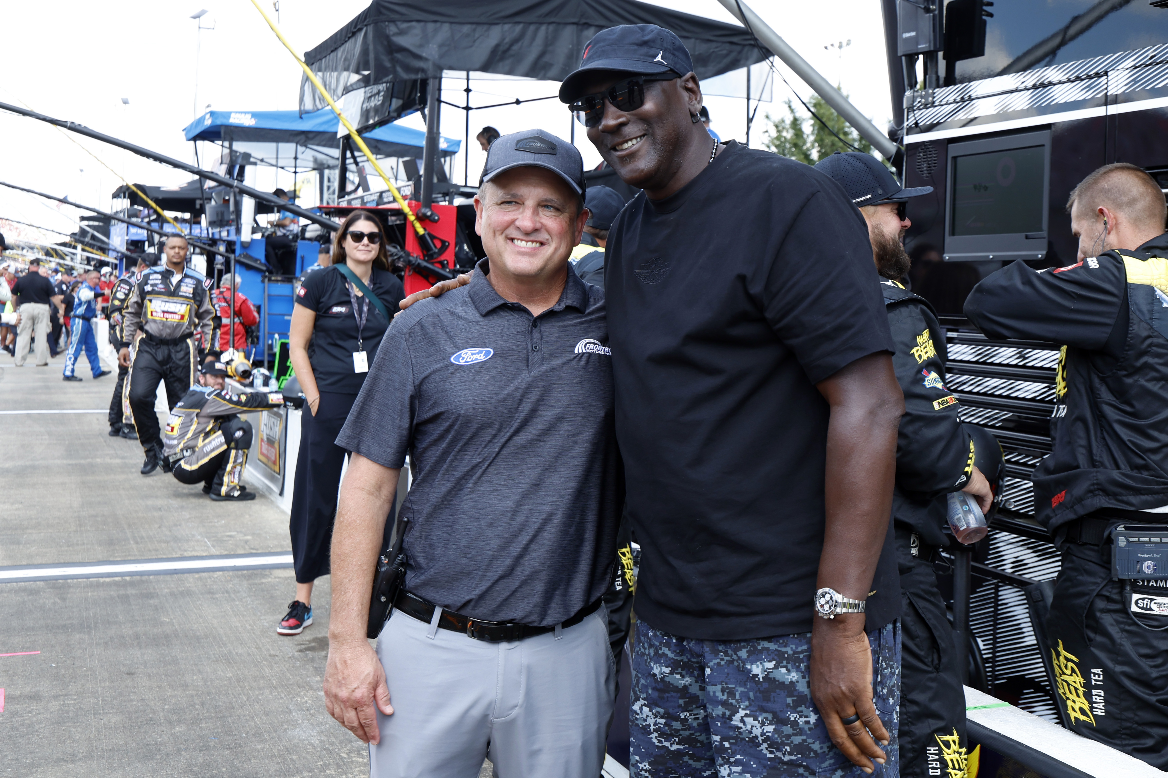 Bob Jenkins, owner of Front Row Motorsports and Co-Owner Michael Jordan, of 23XI Racing, pose before a NASCAR Cup Series auto race at Talladega Superspeedway, Sunday, Oct. 6, 2024, in Talladega, Ala.