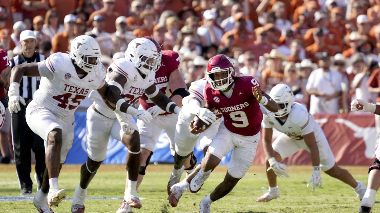 Oklahoma quarterback Michael Hawkins Jr. (9) is stripped of the ball by Texas in the second half of an NCAA college football game in Dallas, Saturday, Oct. 12, 2024.