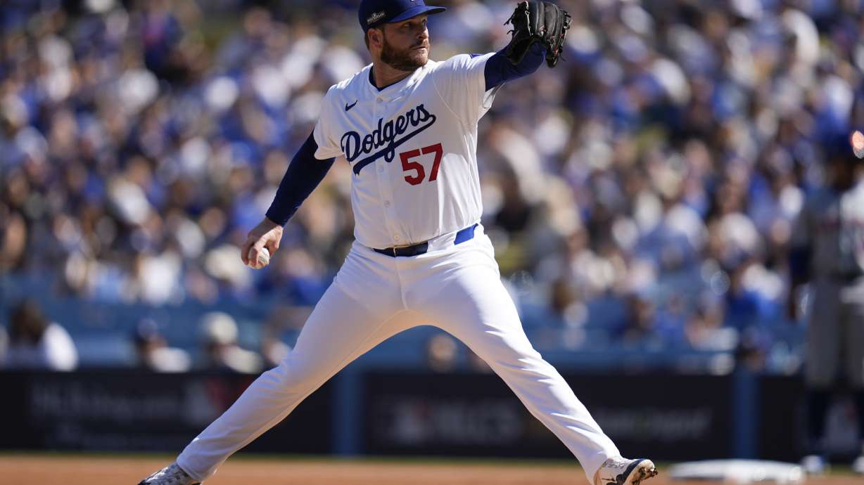 Los Angeles Dodgers pitcher Ryan Brasier throws against the New York Mets during the first inning in Game 2 of a baseball NL Championship Series, Monday, Oct. 14, 2024, in Los Angeles.