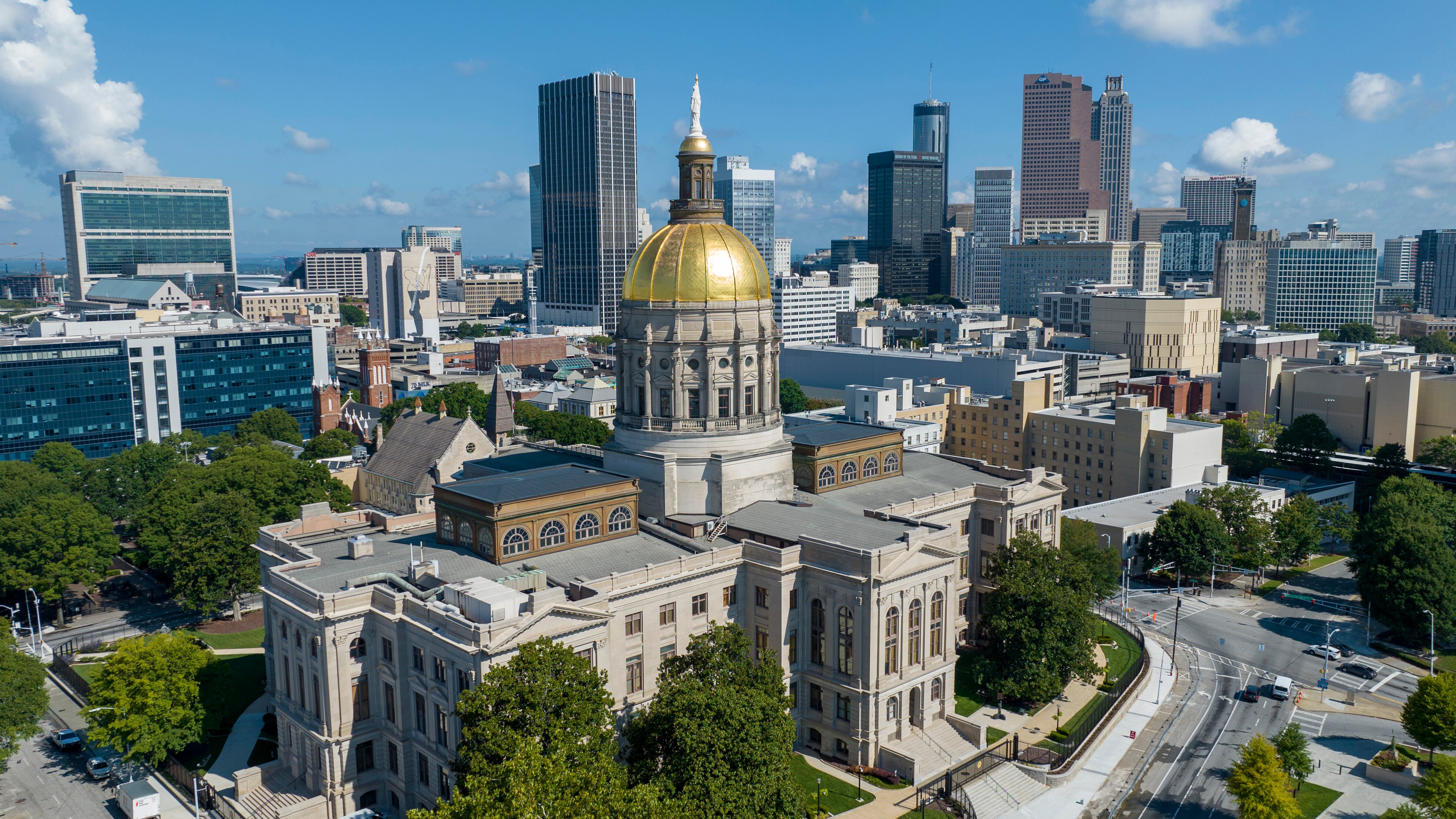 The gold dome of the Georgia Capitol gleams in the sun, Aug. 27, 2022, in front of the skyline of downtown Atlanta. Generation Z has gained a unique perspective on how the country's future should be managed.