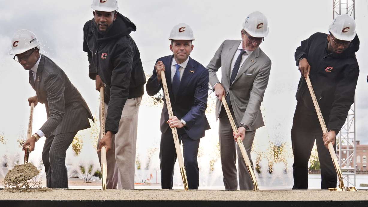 From left, Cleveland Mayor Justin Bibb, Cleveland Cavaliers' Evan Mobley, Nic Barlage, Cleveland Cavaliers, Rocket Mortgage FieldHouse and Rock Entertainment Group, CEO, Tom Mihaljevic, MD, Cleveland Clinic, CEO and Cavaliers' Donovan Mitchell, participate in ground breaking ceremonies for a new practice facility for the NBA basketball team and the first Cleveland Clinic-backed professional facility open to the public, Monday, Oct. 14, 2024, in Cleveland.