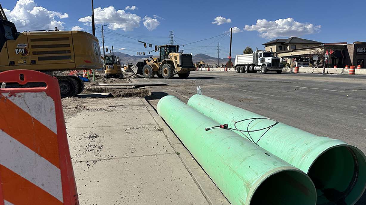 Bangerter Highway was closed in both directions at 13400 South for several hours Friday after construction crews hit a gas line.
