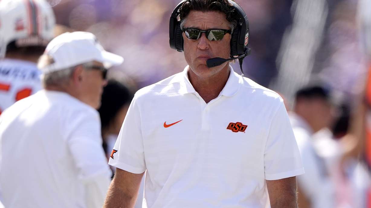 Oklahoma State head coach Mike Gundy watches during the first half of an NCAA college football game against Kansas State Saturday, Sept. 28, 2024, in Manhattan, Kan.