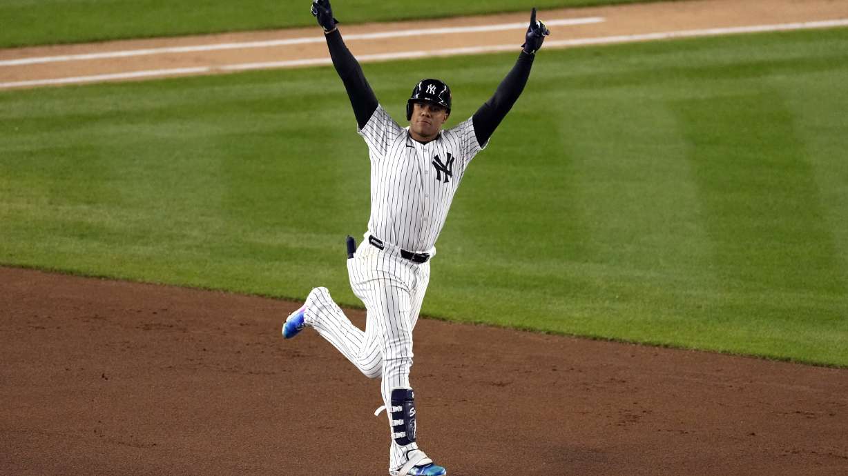 New York Yankees' Juan Soto celebrates after hitting a home run against the Cleveland Guardians during the third inning in Game 1 of the baseball AL Championship Series Monday, Oct. 14, 2024, in New York.