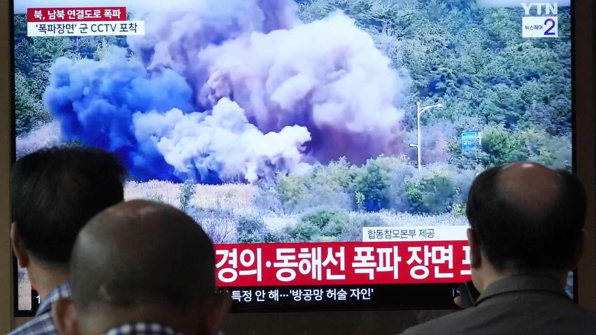 A TV screen reports North Korea has blown up parts of the northern side of inter-Korean roads during a news program at Seoul Railway Station in Seoul, South Korea, Tuesday.