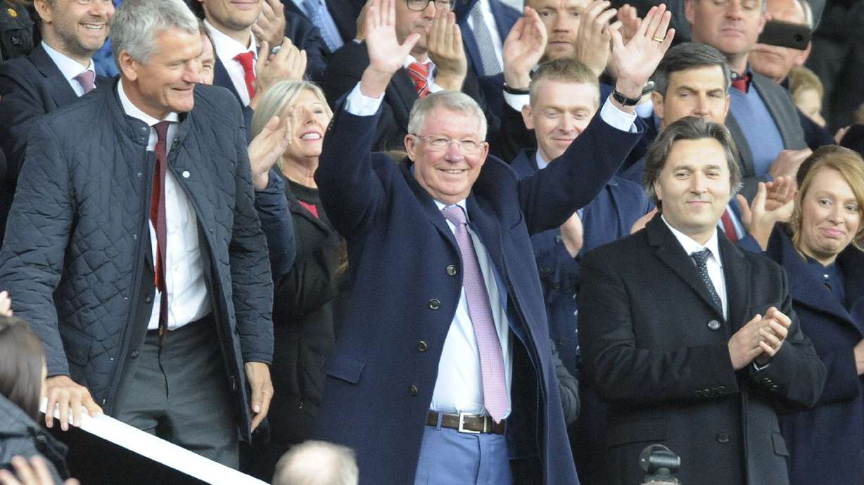 FILE - Former Manchester United manager Alex Ferguson waves as he takes his seat on the stands before the English Premier League soccer match between Manchester United and Wolverhampton Wanderers at Old Trafford stadium in Manchester, England, Saturday, Sept. 22, 2018.