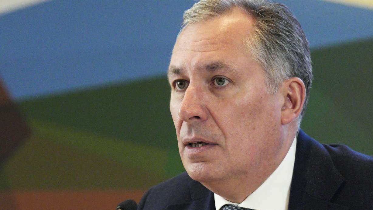 FILE - President of the Russian Olympic Committee Stanislav Pozdnyakov speaks during the annual meeting of Russian Olympic Committee members in Moscow, Russia, Thursday, Dec. 9, 2021.
