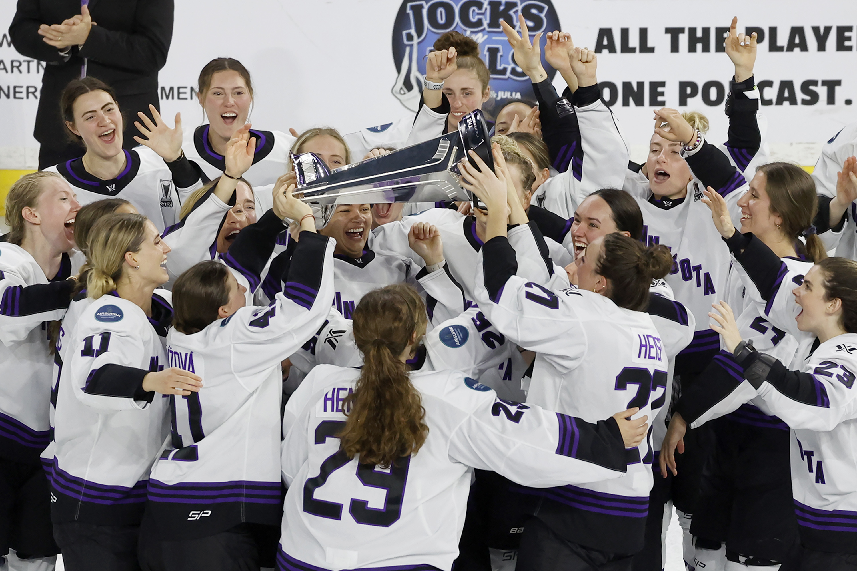 FILE - Minnesota players celebrate with the Walter Cup after defeating Boston to win the PWHL Walter Cup, May 29, 2024, in Lowell, Mass.