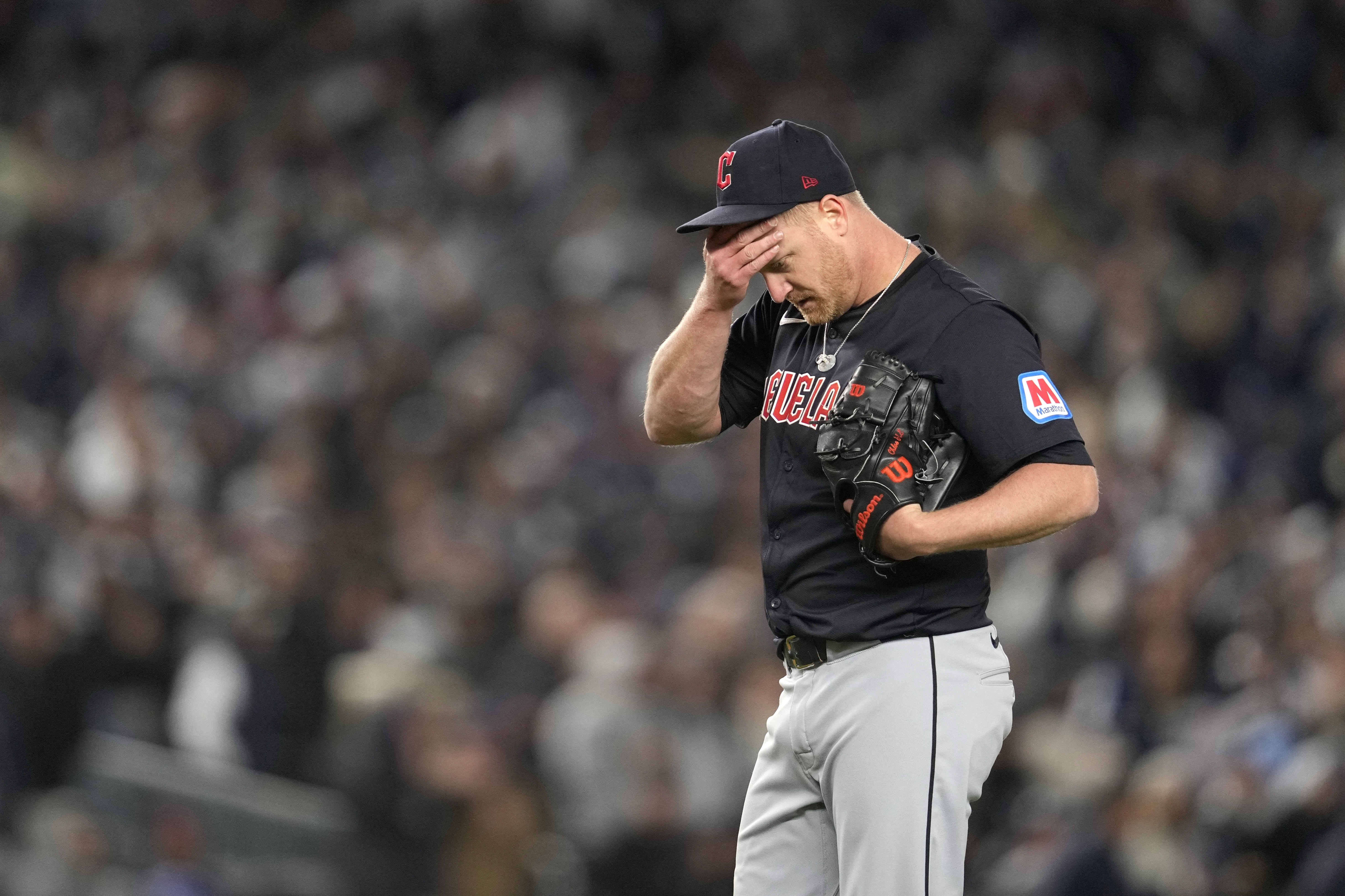 Cleveland Guardians starting pitcher Alex Cobb reacts after walking New York Yankees' Anthony Volpe during the third inning in Game 1 of the baseball AL Championship Series Monday, Oct. 14, 2024, in New York.