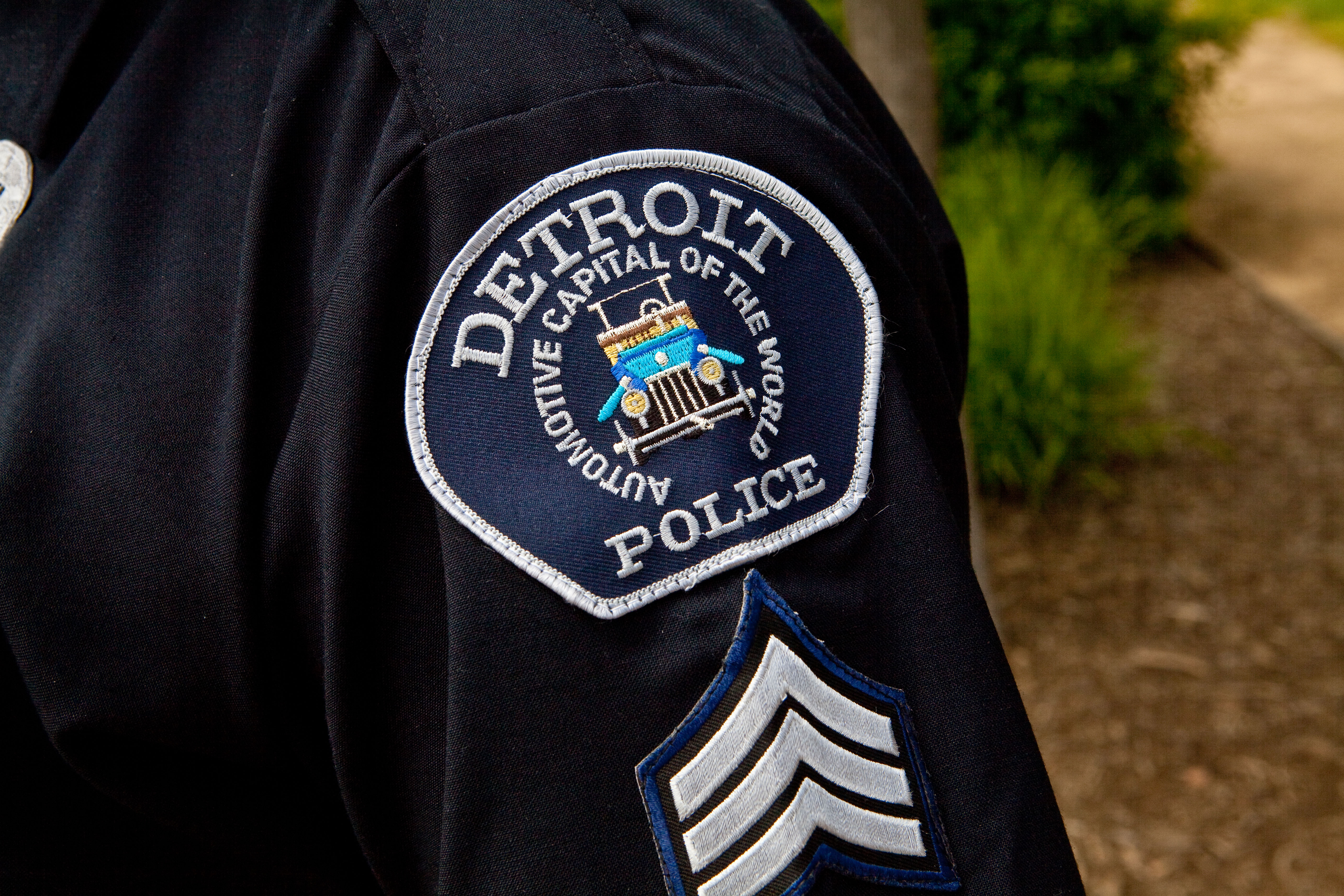 Two Detroit police officers have been wounded after coming under gunfire by an off-duty officer who threatened suicide and later was fatally shot.