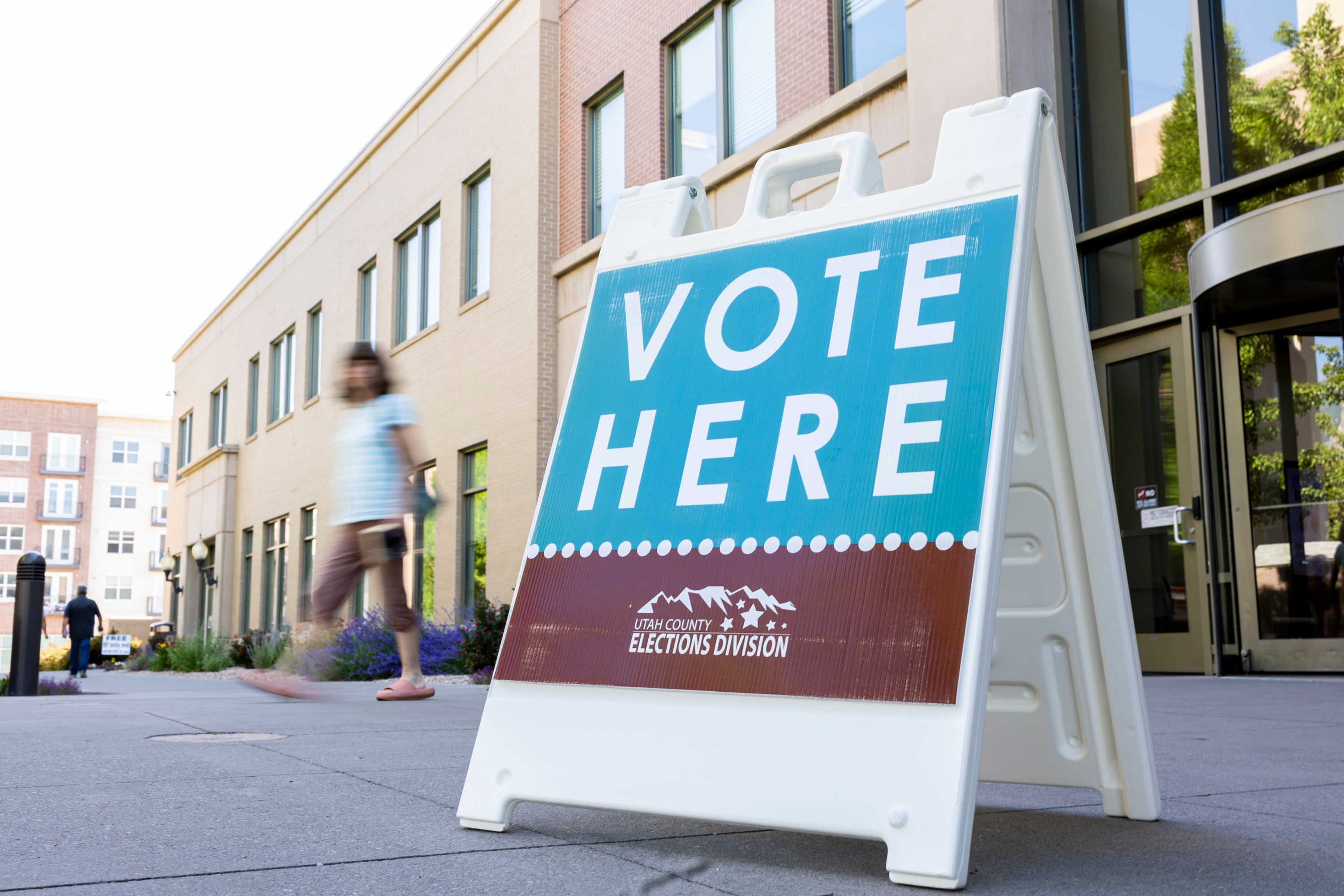 A “Vote Here” sign at the Utah County Health and Justice Building in Provo on June 25. The pitch for Latter-day Saint votes continues, as Vice President Kamala Harris and former President Donald Trump made direct calls to voters over the weekend.