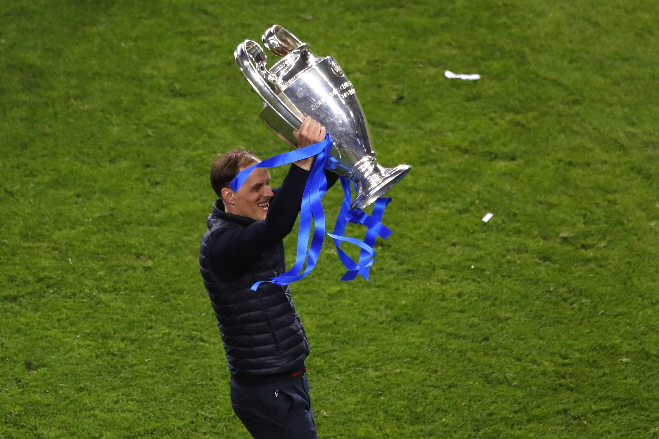 FILE - Chelsea's head coach Thomas Tuchel celebrates with the trophy after winning the Champions League final soccer match against Manchester City at the Dragao Stadium in Porto, Portugal, Saturday, May 29, 2021.