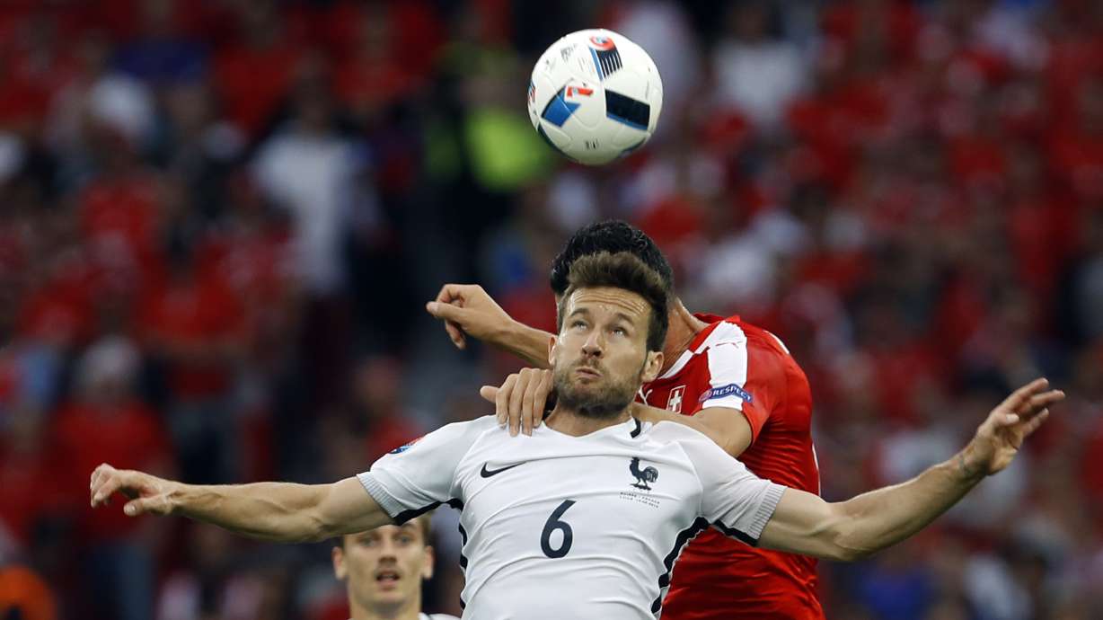 FILE - France's Yohan Cabaye, who has been named as the sporting director of French champion Paris Saint-Germain's youth academy, jumps for the ball during the Euro 2016 Group A soccer match between Switzerland and France at the Pierre Mauroy stadium in Villeneuve d'Ascq, near Lille, France, on June 19, 2016.