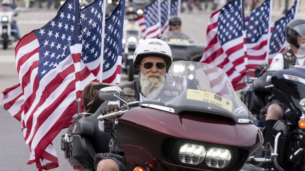 Participants in the "Rolling to Remember" motorcycle rally ride past Arlington Memorial Bridge in Washington, May 28, 2023. A new study compiling decades of fatal motorcycle crashes is being released by the Insurance Institute for Highway Safety.