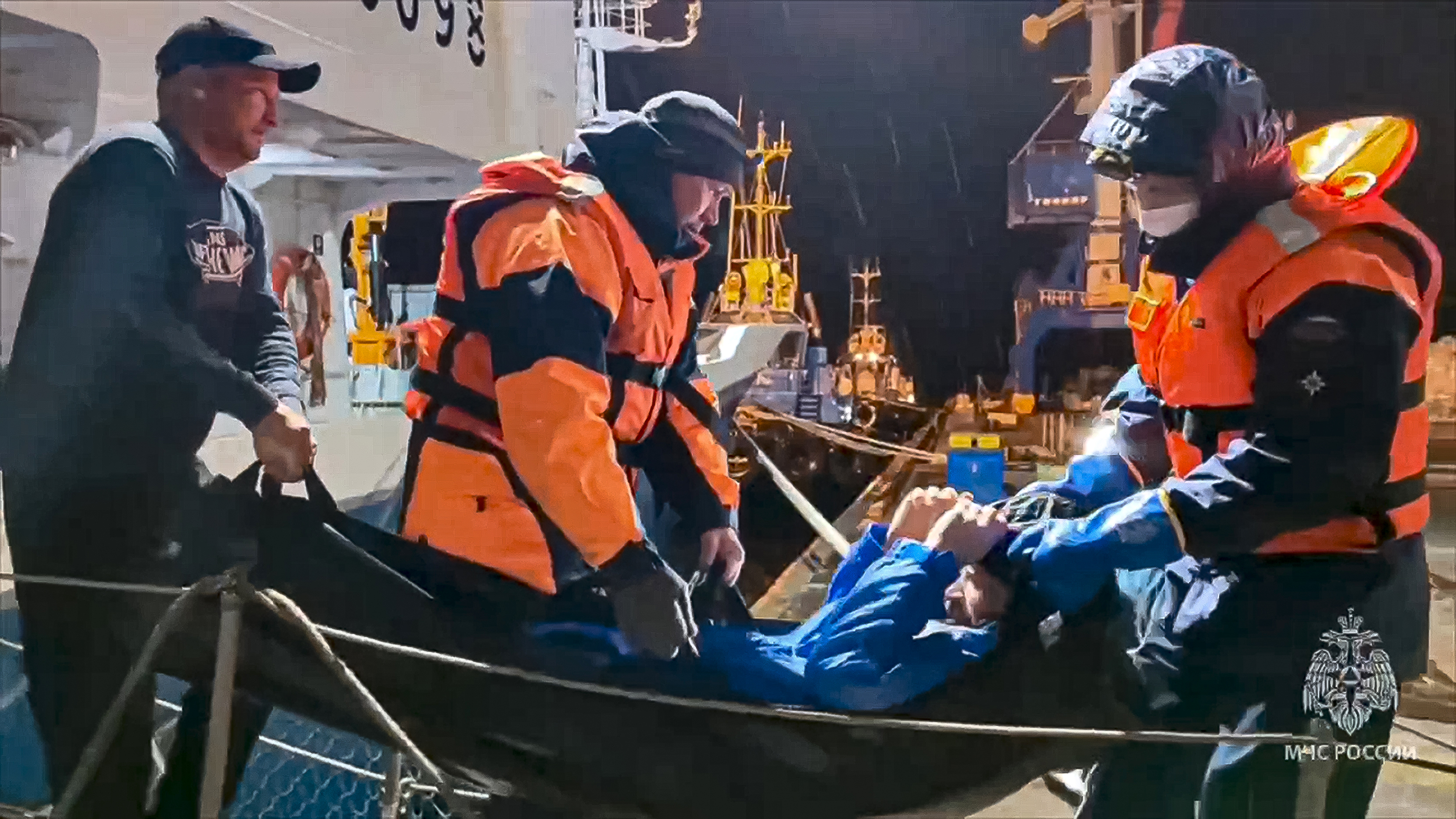 In this photo released on Tuesday, Russian emergency workers pull Mikhail Pichugin ashore after he was rescued by a fishing vessel following 67 days adrift in the Sea of Okhotsk in the Russian far east. 