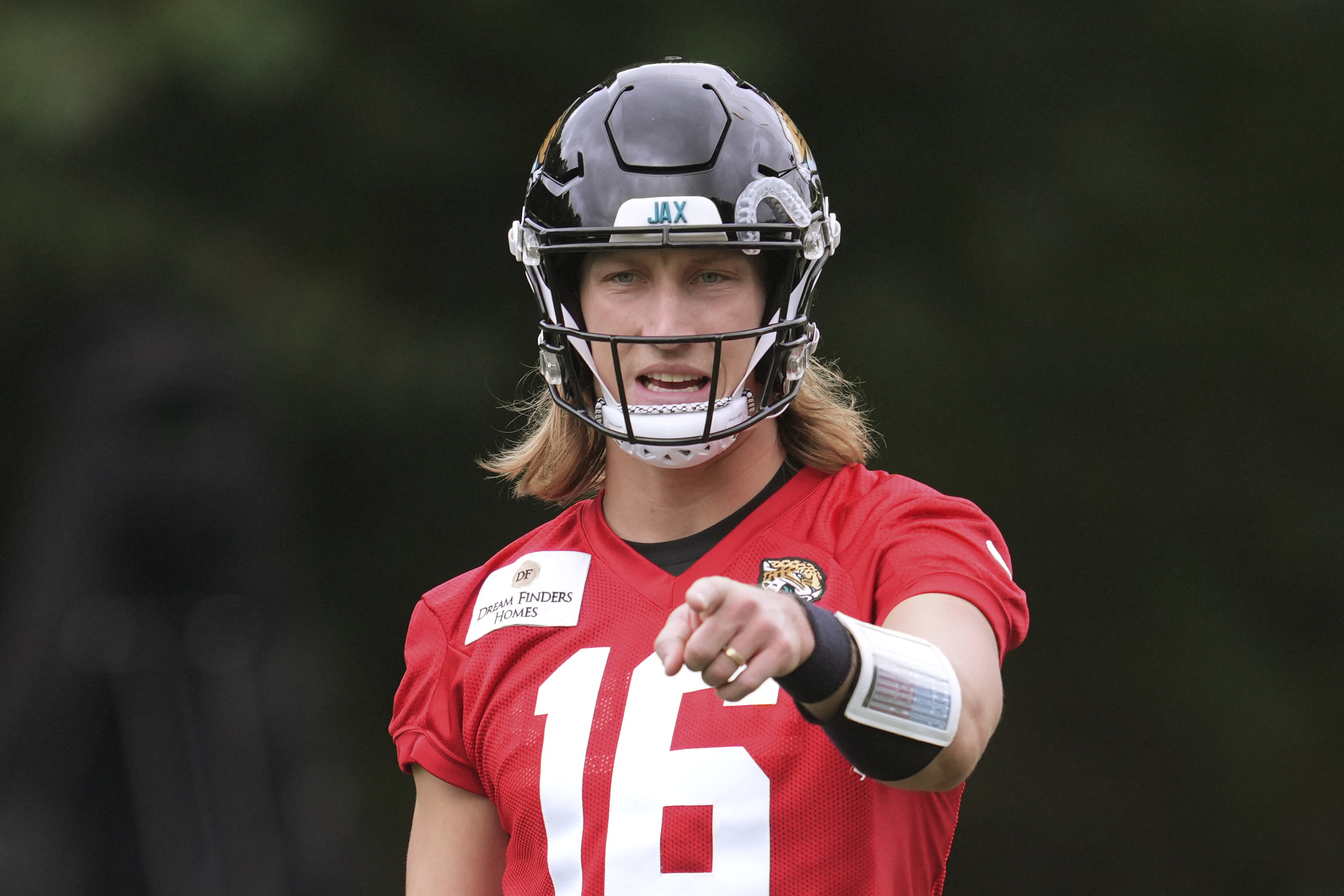 Jacksonville Jaguars NFL football quarterback Trevor Lawrence (16) practices at The Grove in Watford, England, Wednesday, Oct. 16, 2024.