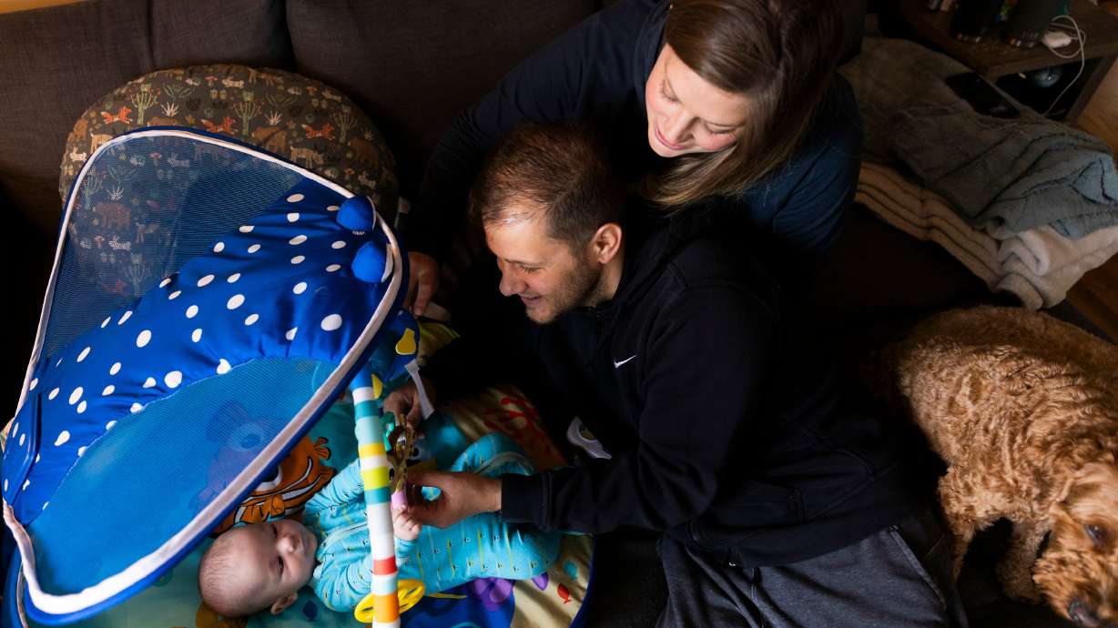 Nicole and Simone Atzeni play with their son Edoardo at their home in Salt Lake City, on May 8. The family lost their first child. University of Utah Health has been named the nation's first Stillbirth Center of Excellence.