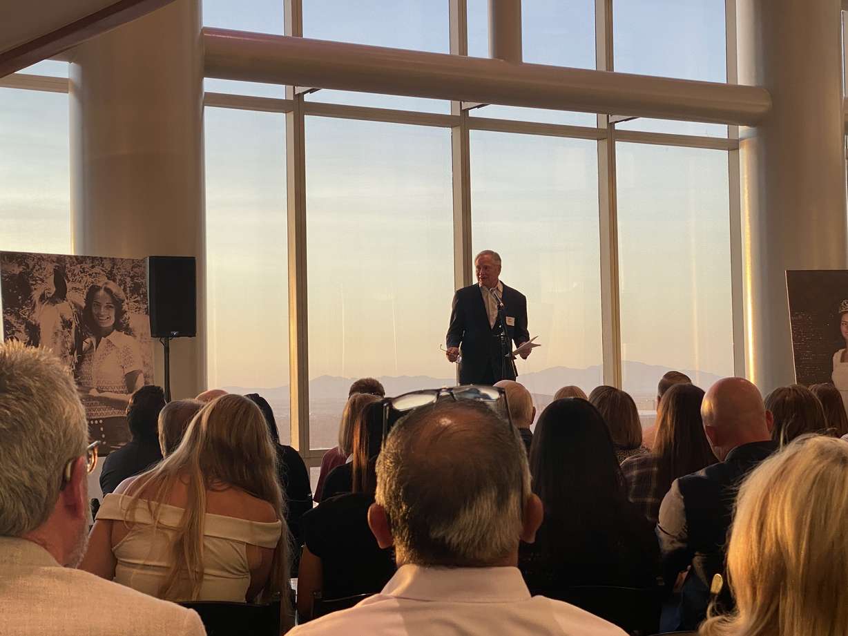 John R. Miller addresses a crowd at the book launch for "Hometown Betrayal," a story about his former wife, Valarie Clark Miller, her sexual assault as a child, and the cover-up that followed, on Tuesday.
