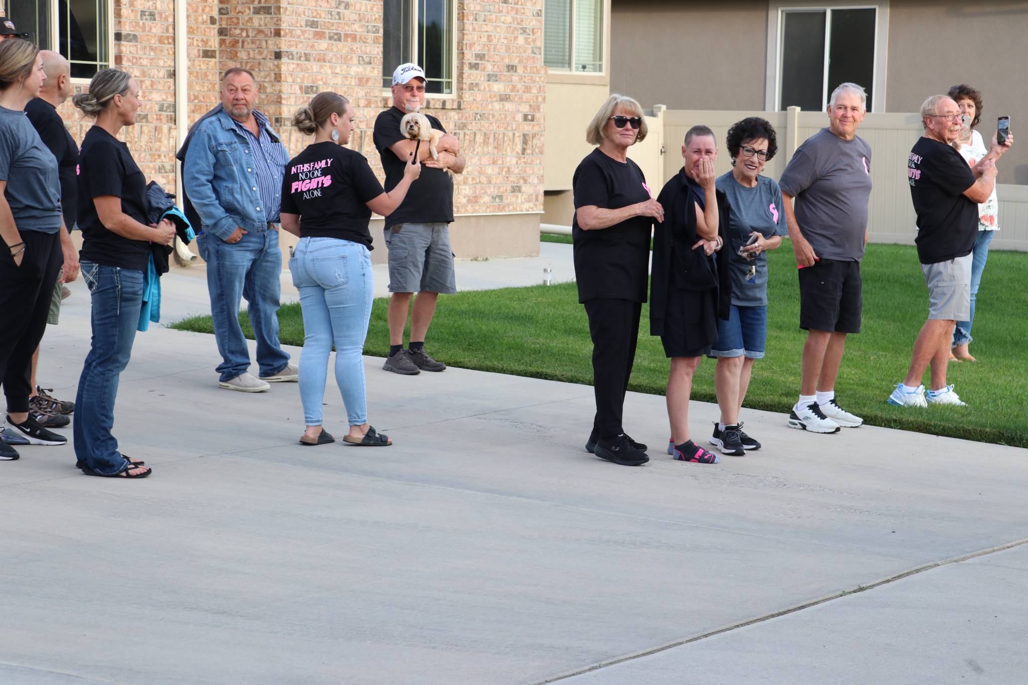 Jennifer Slavensky works for the U.S. Postal Service and is battling breast cancer. She was quite emotional as she stood outside watching the decorated trucks, driven by her co-workers pass by Friday in Price.